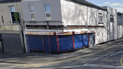 Edwin Williams The site of Terribile's Ice Cream shop today, a blue shuttered kebab shop on the corner of an ashalt road with double yellow lines