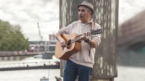 Trevor George Trevor busking in Bristol