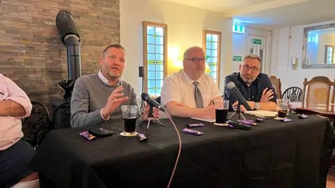 Candidates from the Conservatives, Labour and the Liberal Democrats at a pub debate