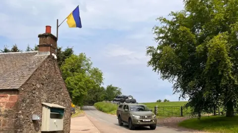 Pickup with Ukrainian flag