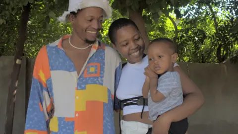 Nhlanhla Moshomo Couple with a baby