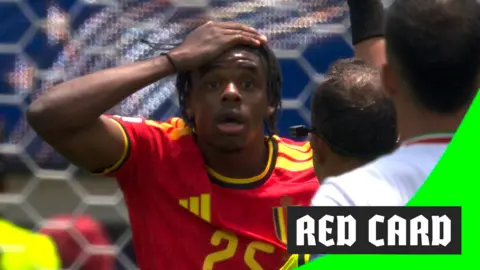 Nathan Ngoy reacts to getting a red card at the 2026 World Cup