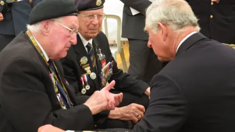 Mike Fuller John Ainsworth, left, and Ray Lord meet the then Prince of Wales during D-Day commemorations in France