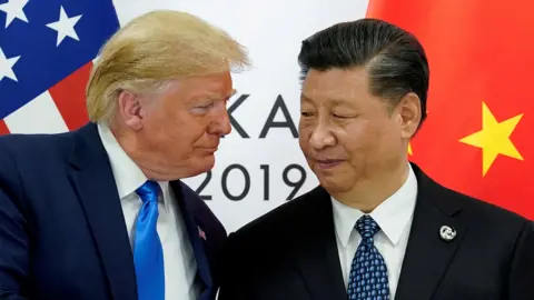 President Donald Trump and China's President Xi Jinping exchange a look at the start of their bilateral meeting at the G20 leaders summit in Osaka, Japan, June 29, 2019. 