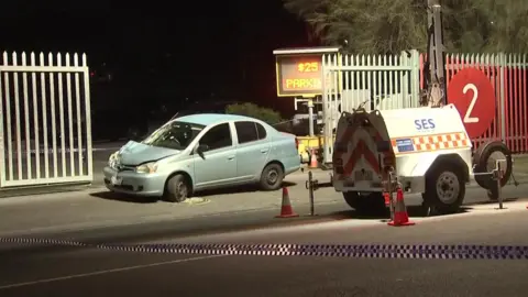 A police cordon around the car involved 