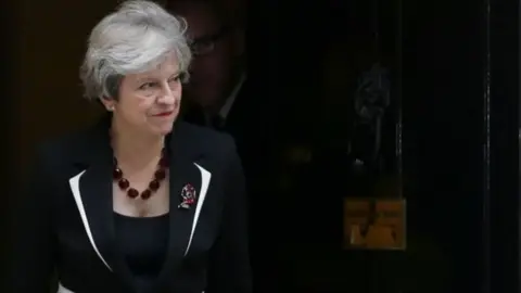 AFP Theresa May walking outside Number 10 Downing Street