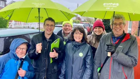 Green Party councillor Suzanne Wateridge with Green Party candidate for Waveney Valley Adrian Ramsey and campaign helpers