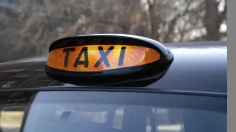 BBC A generic illuminated taxi sign