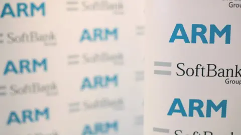 An ARM and SoftBank Group branded board is displayed at a news conference in 2016