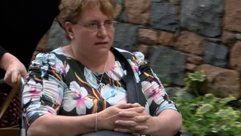 BBC Christine Smith, who has been living with MS for more than five years, arrives at Guernsey's Royal Court