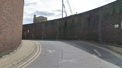 A google image of Friary Passage in Guildford, with the wall on the right-hand side backing onto the Electric Theatre