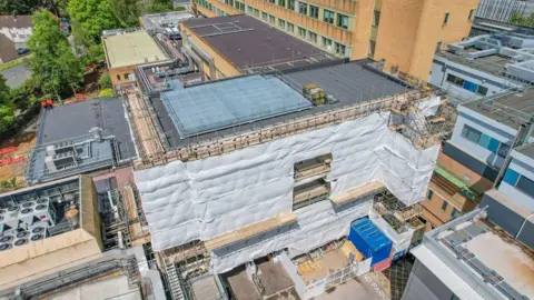 Somerset NHS Foundation Trust An aerial shot of a hospital building with scaffolding around it