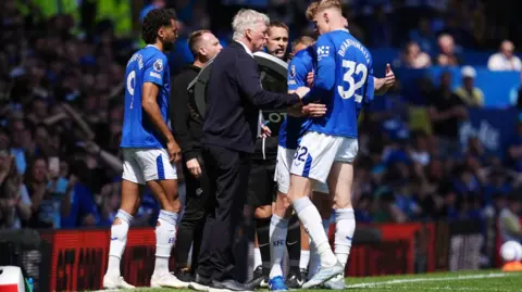 PA Media Manager David Moyes speaks to his players during the match from the touchline as substitutions are made