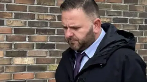 Paul Higgins outside court