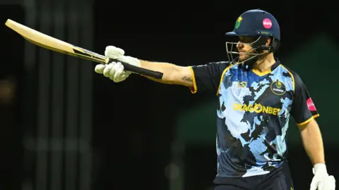 Glamorgan's Sean Dickson raises the bat
