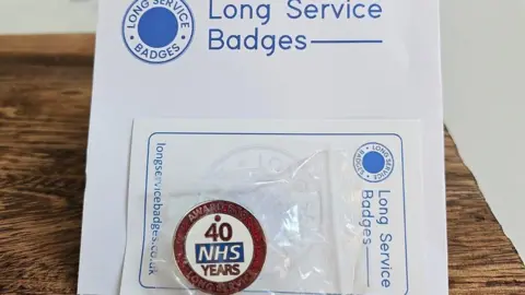 Mary Farnworth NHS long service award badge for 40 years' service