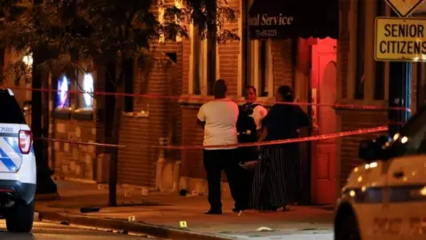 AFP Scene of the shooting in Gresham, Chicago, on 21 July 2020