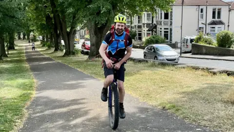 BBC Luke Evison on his unicycle
