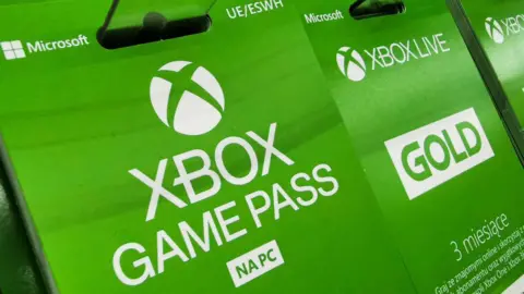 Getty Images Game Pass vouchers on sale in a supermarket