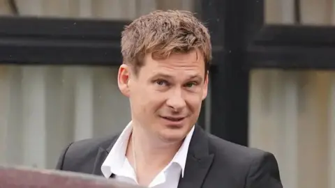 Blue star Lee Ryan outside court in 2023