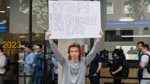 Getty Images A protester holding up a placard