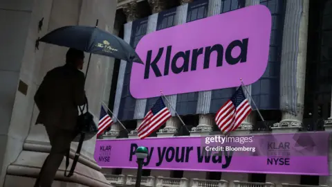 Bloomberg via Getty Images Klarna Group PLC reports during the initial public offer (IPO) of the company on the New York Stock Exchange 
