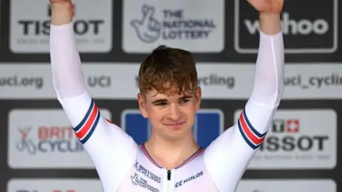 Great Britain's Ben Wiggins celebrating with his arms aloft