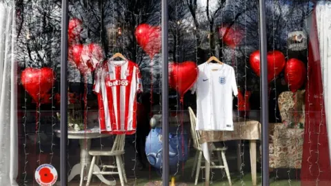 Reuters Shop window with shirts