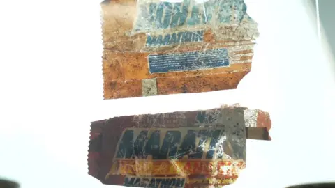 Mike Liggins/BBC A Marathon bar wrapper