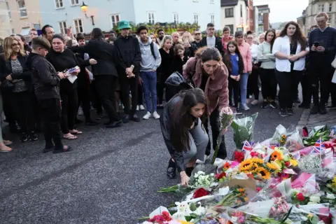 Chris Jackson/Getty Images Members of the public leave flowers outside Windsor Castle