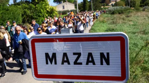 Reuters People are marching in Mazan