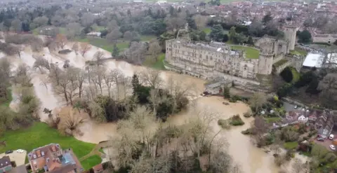 Drone footage of the flooded River Avon in Warwick. Warwick Castle is to the right of the river.