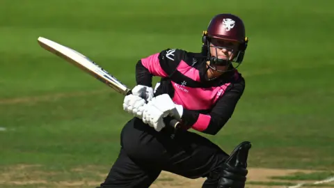 Fran Wilson plays a reverse sweep for Somerset Women