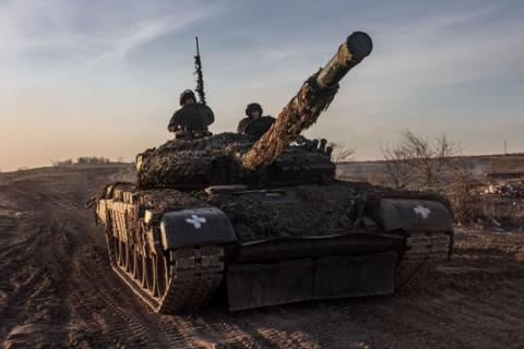 Ukrainian soldiers drive a tank