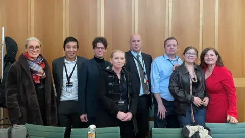 Family picture Picture of several people in the houses of parliament