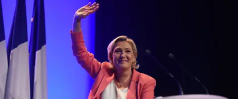 Getty Images File pic of Marine Le Pen addressing a National Rally meeting near Paris on 23 September 2018