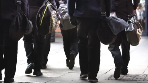 PA Media View of pupils walking in school