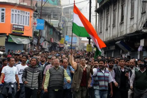 AFP/Getty Images Supporters of the separatist Gorkha Janmukti Morcha (GJM) group take part in a rally to honour protesters they say were killed during clashes with security forces a day earlier, in Darjeeling on June 18, 2017.