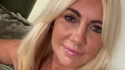 A woman with blonde hair in close up