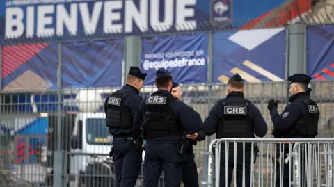 FRANCK FIFE/AFP French riot police in Paris guard the Stade-de-France stadium ahead of a training session for the French and Israeli teams on Wednesday