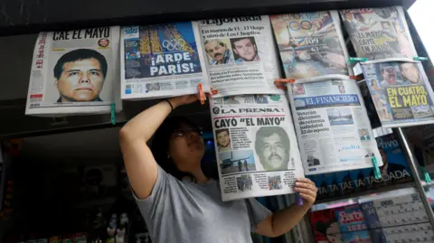 Reuters A newspaper seller arranges newspapers reporting the El Paso, Texas, U.S., arrest of Mexican drug lord Ismael "El Mayo" Zambada 