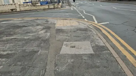 East Riding of Yorkshire Council Part of the footpath of Queen Street, Withernsea. It looks in a poor state. 