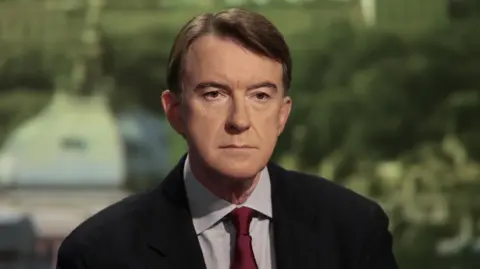 PA Media Close up of Peter Mandelson in 2008, wearing a red tie and dark jacket.