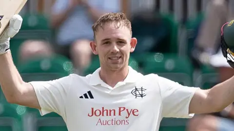 Jack Haynes celebrates scoring a century