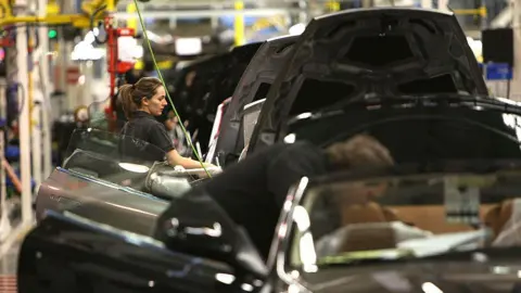Getty Images Aston Martin motor cars roll off the production line at the companies new assembly plant in Gaydon,