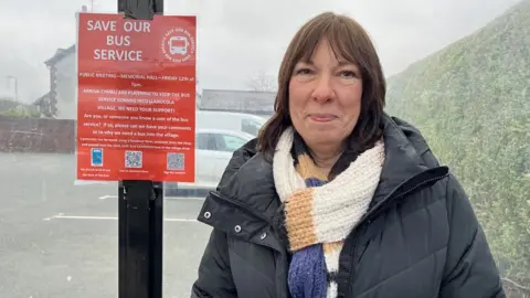 Wendy Spiers, campaigning to keep the bus