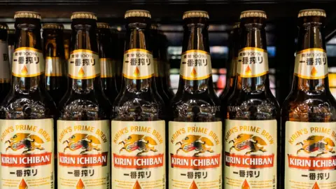 Getty Images Kirin beer bottles on a shelf.