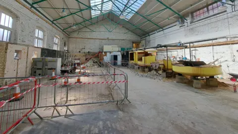 Swindon Borough Council Rubble on the floor and metal barriers inside the Health Hydro