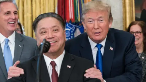 Getty Images Broadcom boss Hock Tan and US President Donald Trump