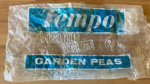 Plastic Free West Somerset Photograph of an empty Tempo-branded bag of garden peas, with its cost showing 2/8